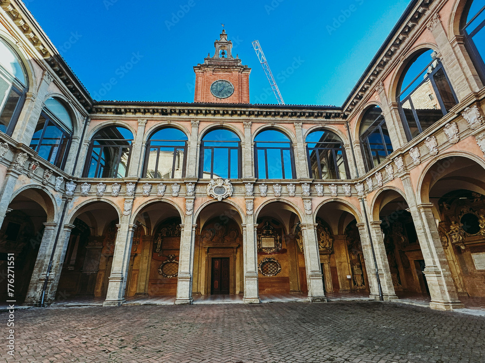View of old building with arched windows in Bologna, Italy. Old medieval Italian architecture