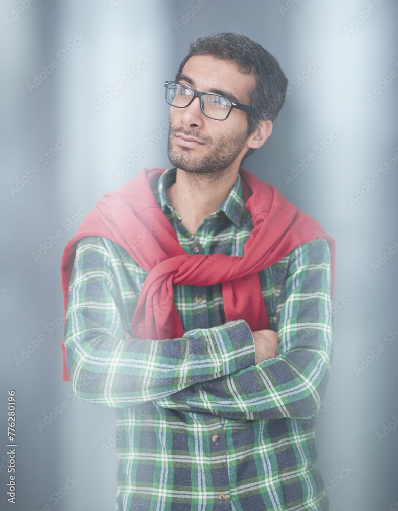 Fototapeta premium Stylish young man posing in the studio on gray background