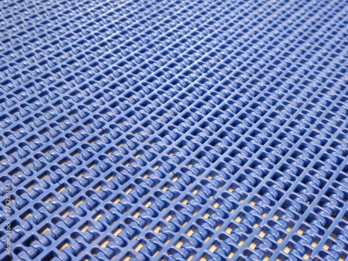 A close-up of a blue polyurethane belt in modular industrial conveyor system. Transport systems in industrial factories. photo