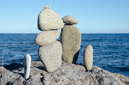 Stones stacked zen-style on the beach