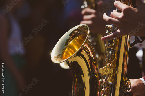 Musician playing the saxophone in the park