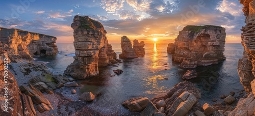 The sunset between the rocks on the beach