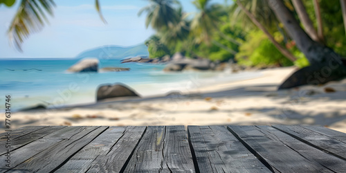 Wooden floor with blurred tropical beach on the background travel concept design photo