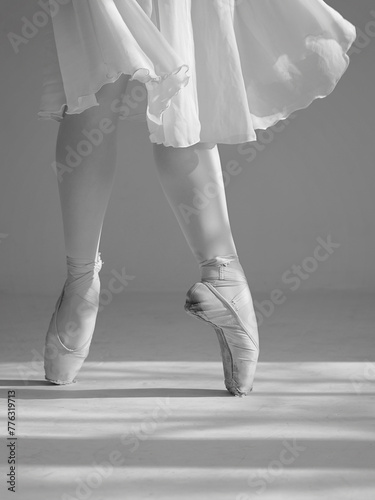 Beautiful ballerina dancing, Legs on pointe shoes close up. Delicate, ethereal aesthetics concept. Black and White image