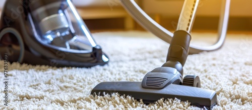 closeup vacuum cleaner on the carpet photo