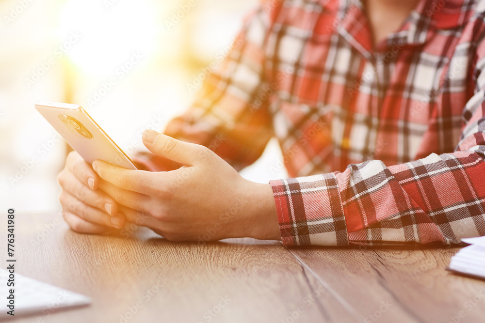 Fototapeta premium Middle aged Hispanic business manager ceo using cell phone mobile app