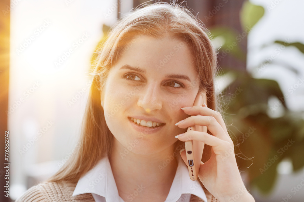 Young charming woman calling with cell telephone Young charming woman calling with cell telephone