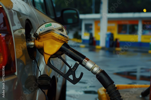 An image capturing a close-up view of a gas pump nozzle refueling a car, with a mask on it, set against the backdrop of a rainy gas station scene.