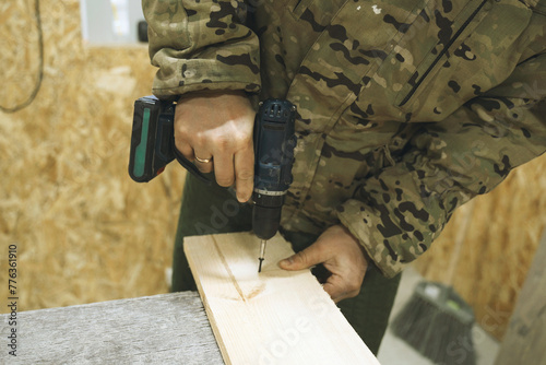 Man Using Drill to Cut Wood