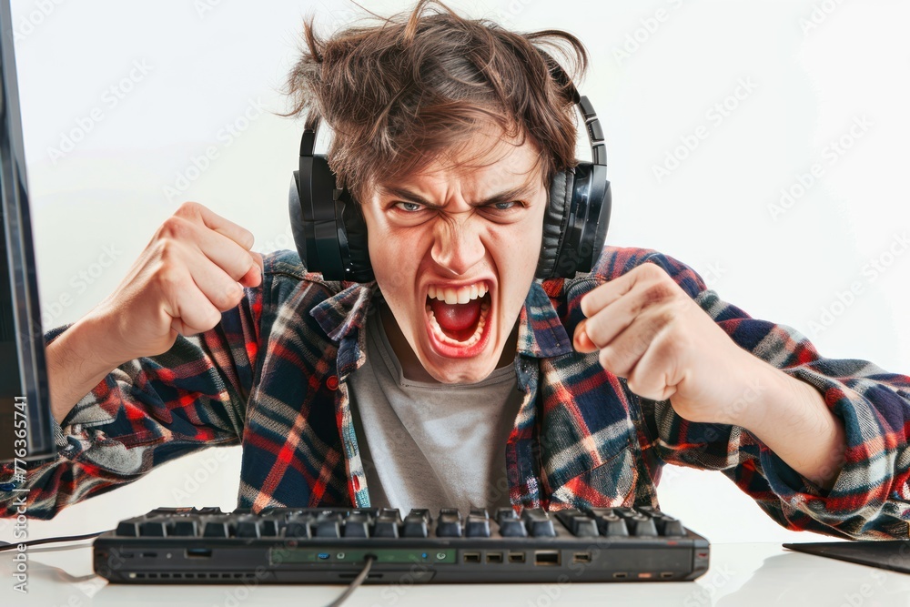 Crazy angry frustrated game addict teenager lost his computer game on solid white background