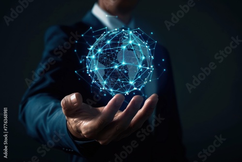 Businessman holding a digital device that represents a global network or internet connection