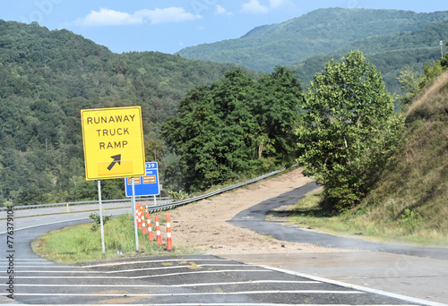 Photos Road with Highway Runaway Truck Ramp in Mountains with Forest