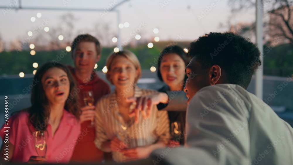Excited girls talking waiter evening modern cafe. Joyful people ordering drinks Excited girls talking waiter evening modern cafe. Joyful people ordering drinks