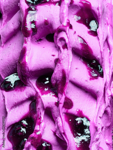 Frozen Blueberry flavour gelato - full frame detail. Close up of a violet surface texture of Ice cream covered with syrup.