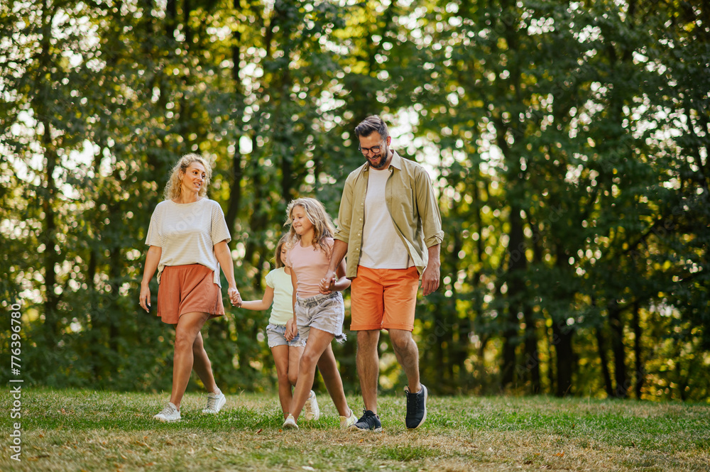 A young family is spending day in nature and walking. A young family is spending day in nature and walking.