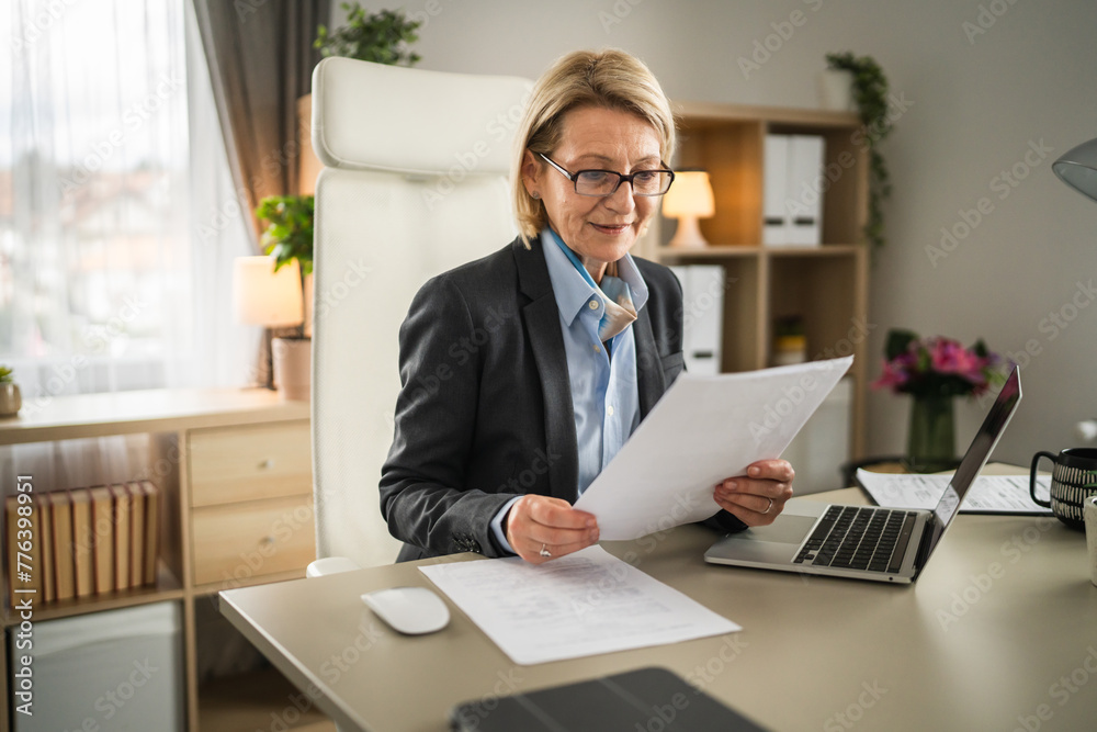 mature woman businesswoman use laptop computer at work at office mature woman businesswoman use laptop computer at work at office