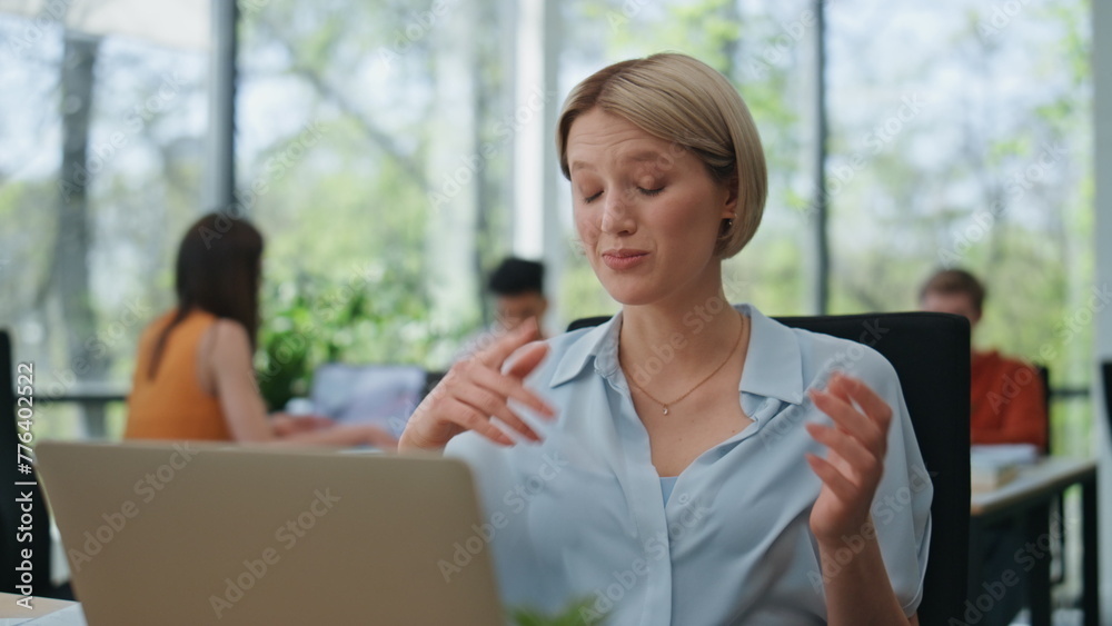 Excited lady speaking laptop call at open space closeup. Gesturing woman talking