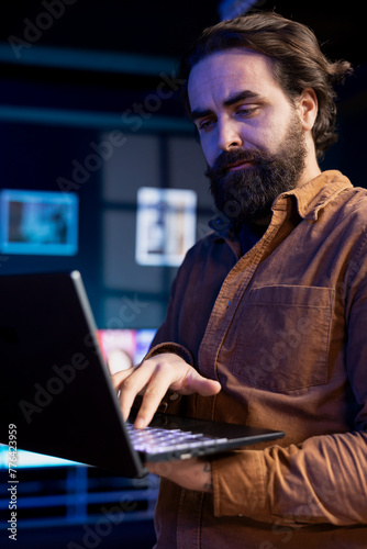 Computer technician doing software quality assurance, reading source code on laptop before implementing it. IT admin inspecting coding on notebook device, looking to fix potential issues