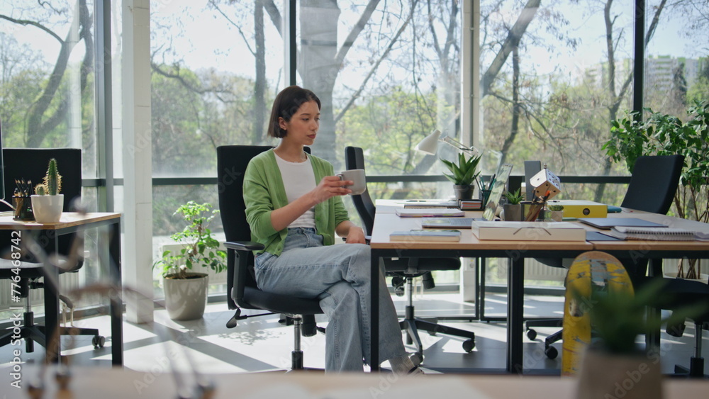 Manager making tea sip in office work break. Girl holding cup coffee beverage Manager making tea sip in office work break. Girl holding cup coffee beverage