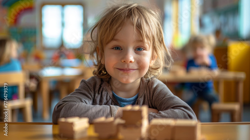 Blue-eyed youngster displaying a genuine smile during playful learning with wooden puzzles.