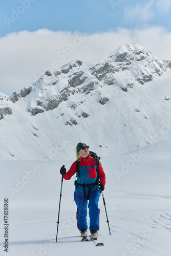 A Female Mountaineer Ascends the Alps with Backcountry Gear © .shock