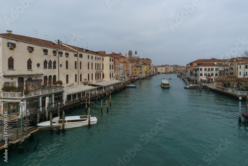 View over the Canal Grande from Ponte degli Scalzi with boats on a winter day in front of typical building facades, Venice, Veneto, Italy