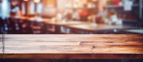 Wooden table top illuminated by soft glowing lights in the background, creating a warm and inviting atmosphere photo