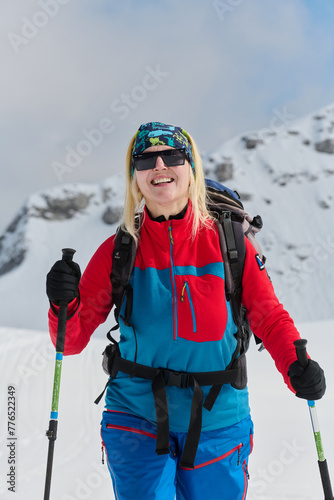 A Female Mountaineer Ascends the Alps with Backcountry Gear