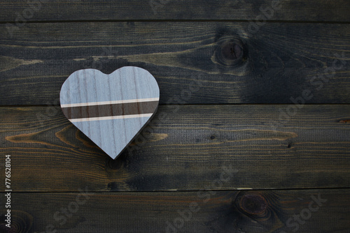 wooden heart with national flag of botswana on the wooden background.