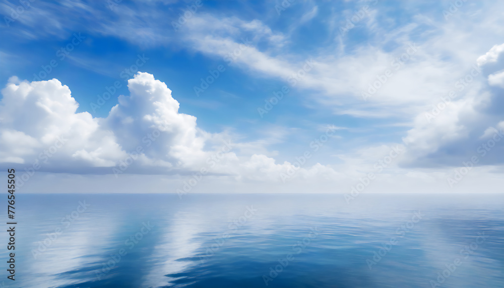 Beautiful blue sky, with fluffy clouds over the calm ocean