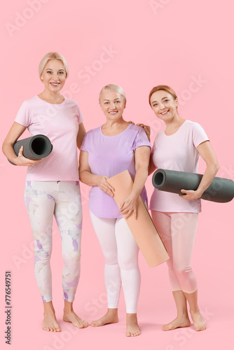 Three mature women holding ...