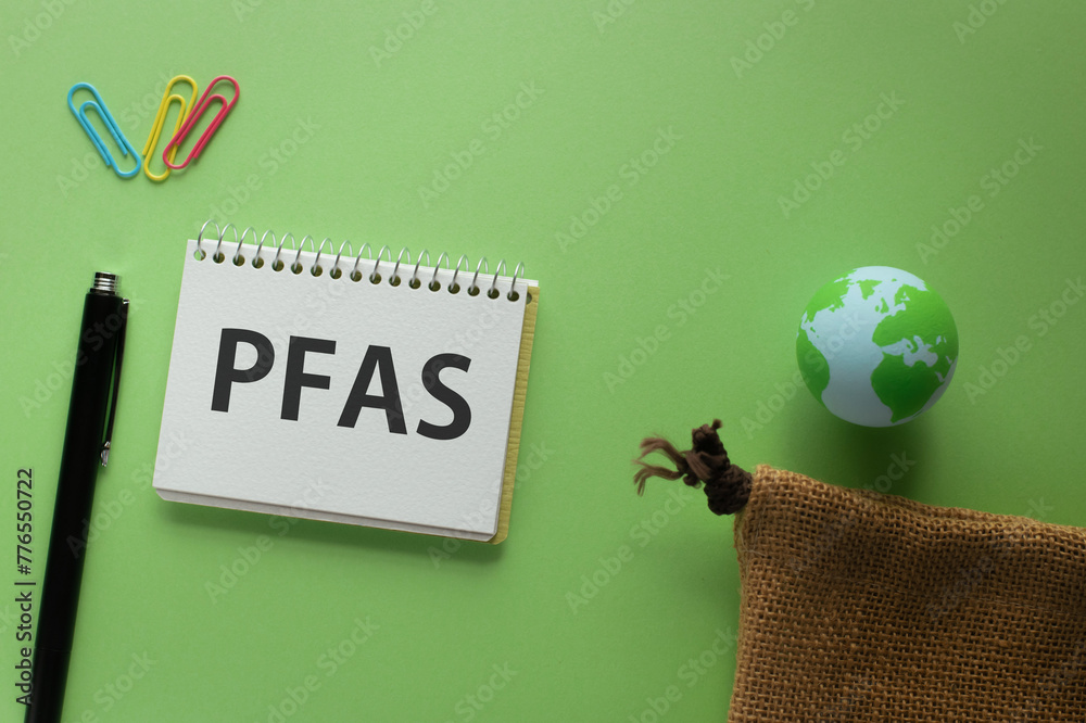 There is notebook with the word PFAS. It is an abbreviation for Per-and Polyfluoroalkyl Substances as eye-catching image. - obrazy, fototapety, plakaty 