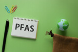 There is notebook with the word PFAS. It is an abbreviation for Per-and Polyfluoroalkyl Substances as eye-catching image.