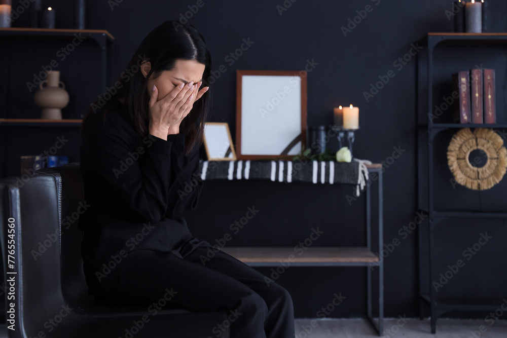 Mourning young Asian woman crying at funeral Mourning young Asian woman crying at funeral