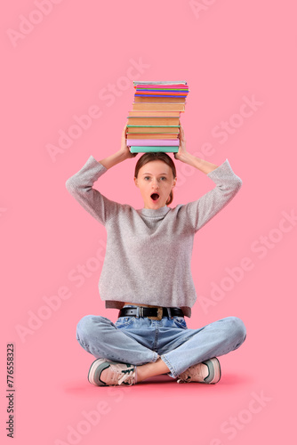 Surprised female student wi...