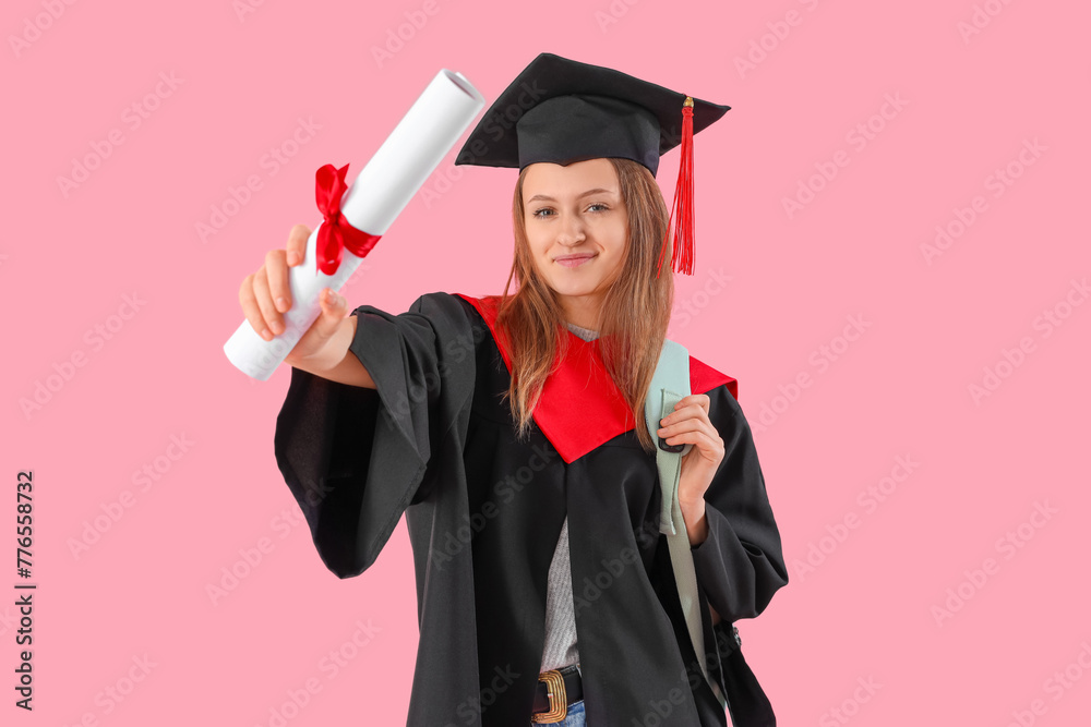 Graduate female student with diploma on pink background. End of school concept Graduate female student with diploma on pink background. End of school concept