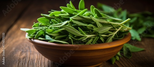 Fresh herbs like basil, thyme, and rosemary are neatly arranged in a ceramic bowl placed on a rustic wooden table