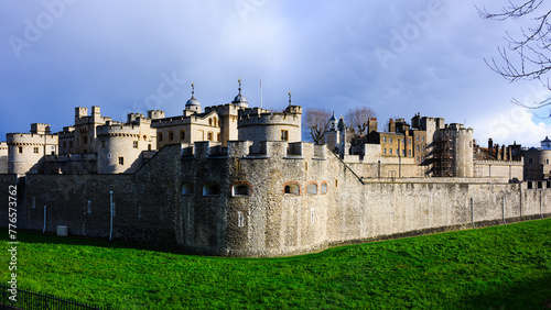 Panoramic external view of walls and towers of Tower of London under dark sky © IanDewarPhotography
