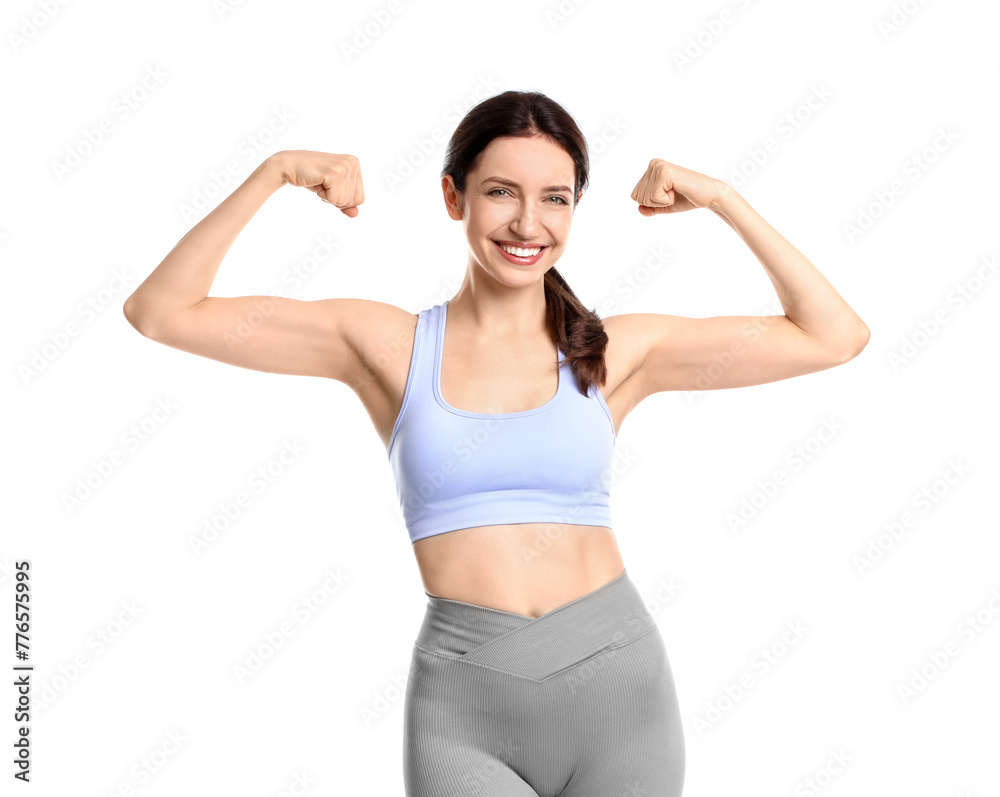 Happy young woman with slim body showing muscles on white background Happy young woman with slim body showing muscles on white background