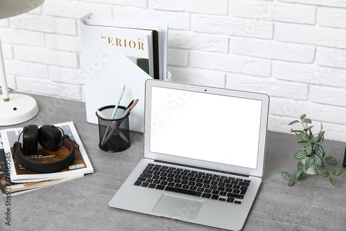 Stylish workplace with mode...