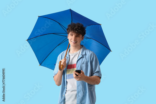 Young man with umbrella and...