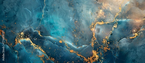 Close up of a blue and gold marble with gold paint