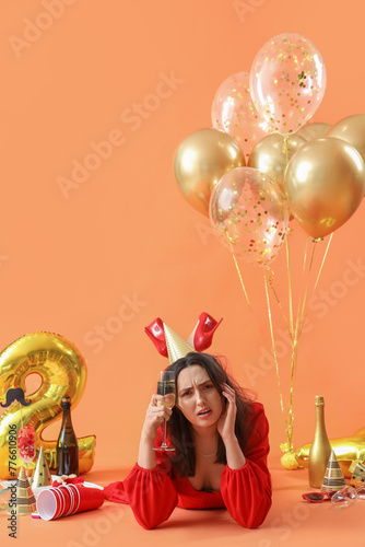 Young woman with hangover a...