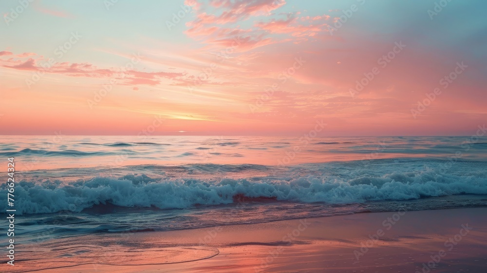 The serene beauty of a calm ocean at sunrise, where gentle waves whisper to the shore under a sky painted in soft hues of pink and orange.