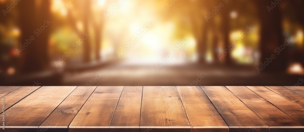 A rustic wooden table top is featured with a soft, out-of-focus background enhancing the simple and natural aesthetic A rustic wooden table top is featured with a soft, out-of-focus background enhancing the simple and natural aesthetic