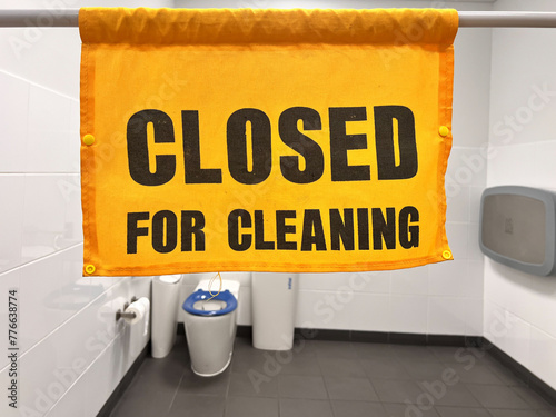 Closed for cleaning sign in public toilet