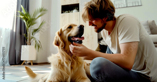 A happy man is communicating with his beloved golden retriever.
