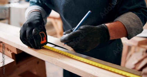 Carpenter, measuring tape and hands with pencil, safety gloves and designer furniture or manufacturing workshop. Creativity, warehouse and professional man at work with pen for development and style photo