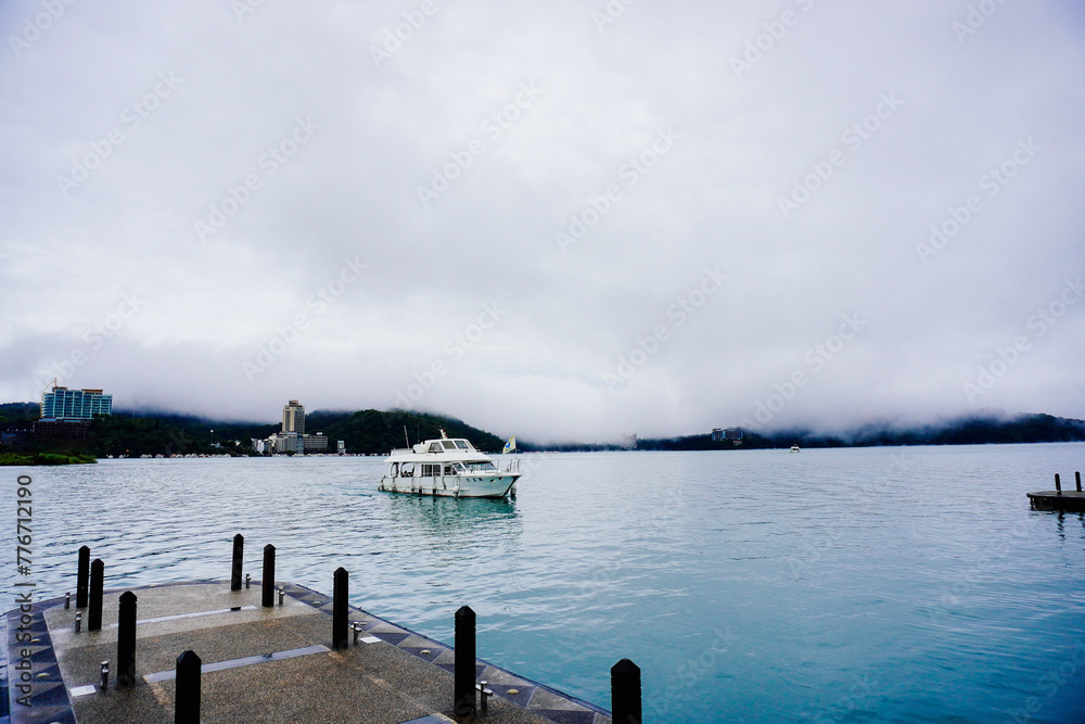 Sun Moon Lake，Nantou, Taiwan, Republic of China, 01 22 2024: The landscape of Sun Moon Lake (Ri Yue pond) in a cloudy and foggy day