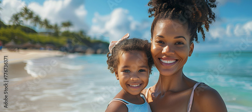 A single African American mother enjoys her summer vacation with her daughter on a sunny paradise beach, with copy space. photo
